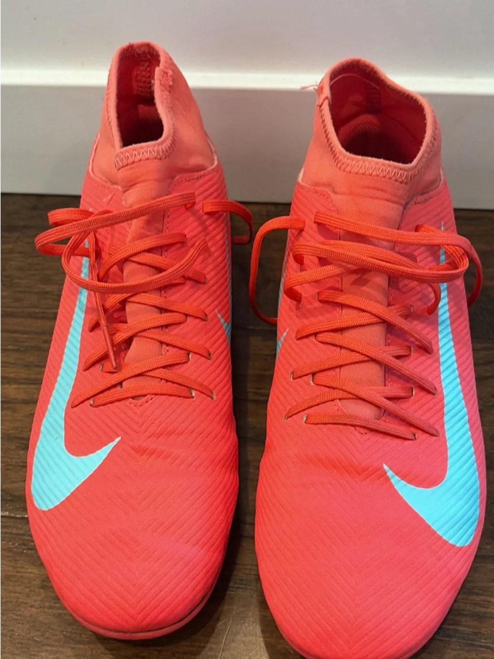Nike Mercurial Superfly Coral Red Soccer Cleats with Light Blue Swoosh